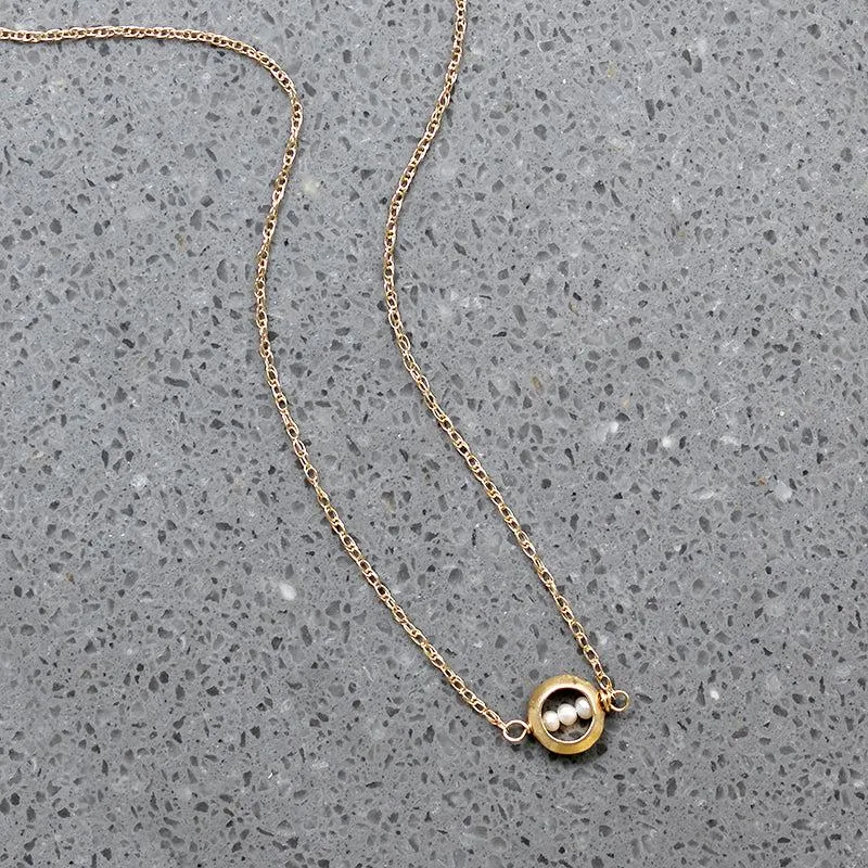 Dainty White Pearls in Gold "O" Necklace by brunet