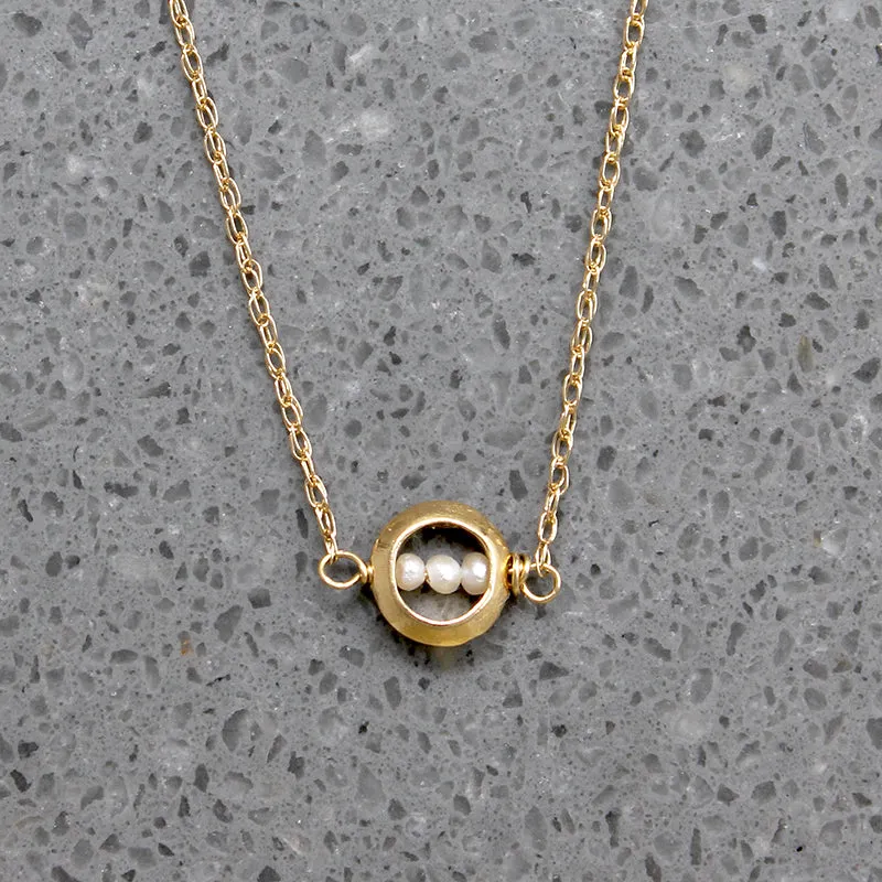 Dainty White Pearls in Gold "O" Necklace by brunet